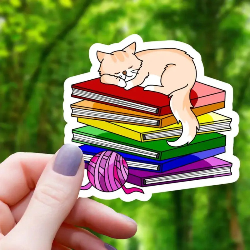 Cat Sleeping on Pride Books Sticker